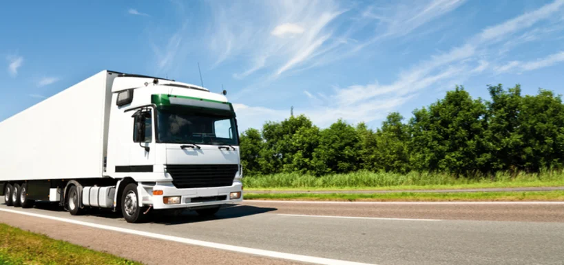 Versand - Truck driving on country-road - Stock-Fotografie