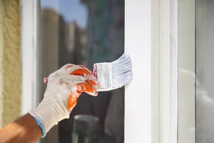 Man painting frame of the window - Stock-Fotografie - Man painting frame of the window - Stock-Fotografie